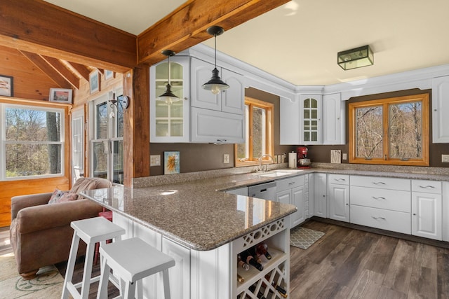 285 County Road 20, Cairo, NY 12413 - kitchen with a sink, glass insert cabinets, white cabinetry, a peninsula, and wood walls