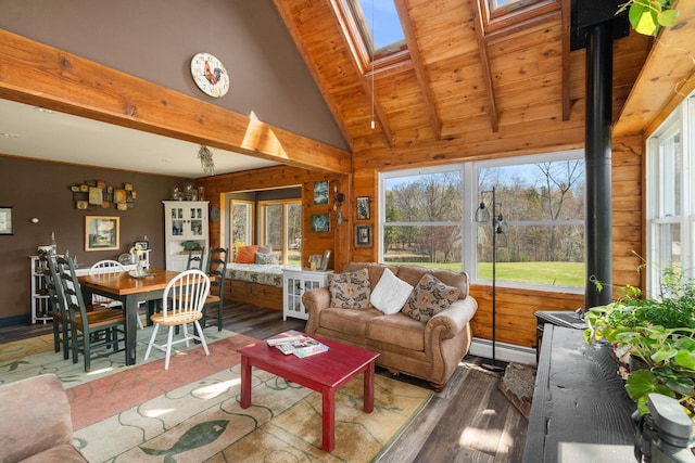 285 County Road 20, Cairo, NY 12413 - living area with a baseboard heating unit, wood ceiling with exposed beams, wood finished floors, healthy amount of natural light, and wood walls