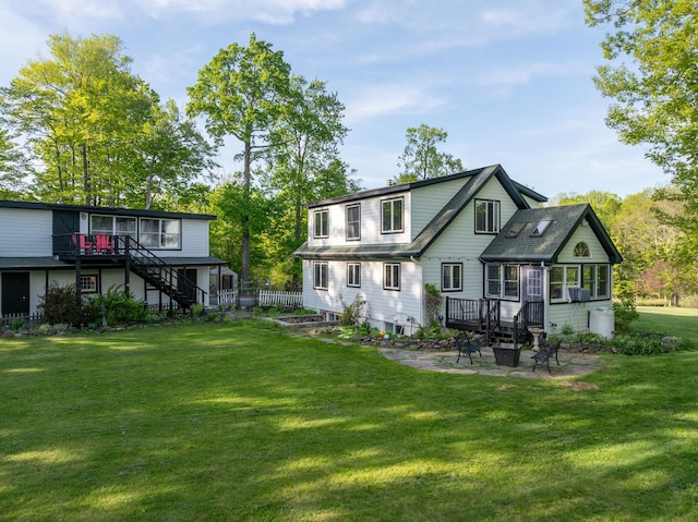285 County Road 20, Cairo, NY 12413 - back of property with stairway, a lawn, a deck, and a patio area