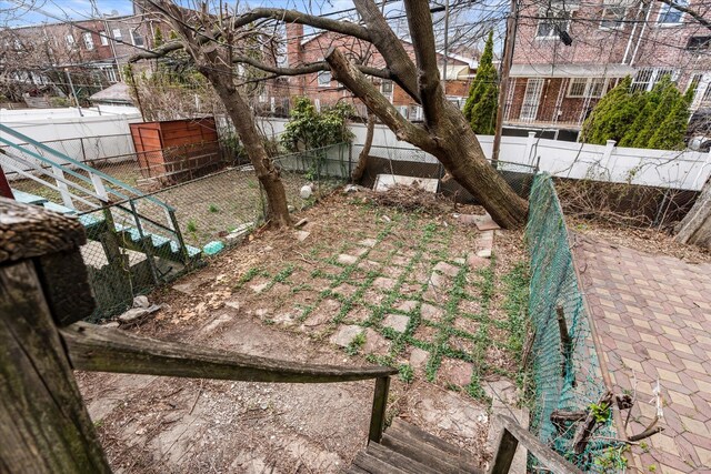 712 E 40th St, Brooklyn, NY 11210 - view of yard featuring fence