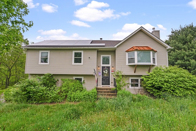 22 Rosio Ln, Modena, NY 12548 - split foyer home with roof mounted solar panels and a chimney