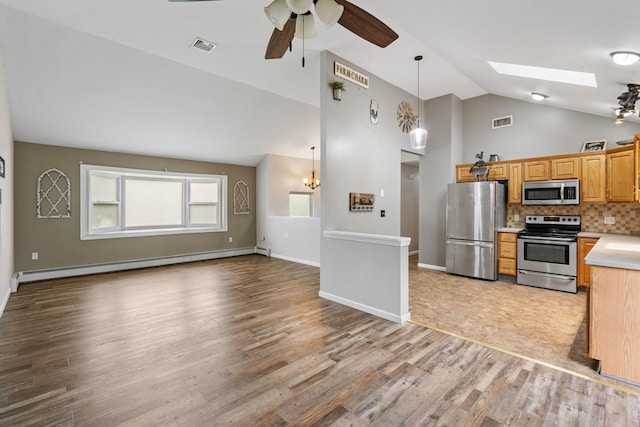 22 Rosio Ln, Modena, NY 12548 - kitchen featuring appliances with stainless steel finishes, baseboard heating, ceiling fan, light wood finished floors, and light countertops