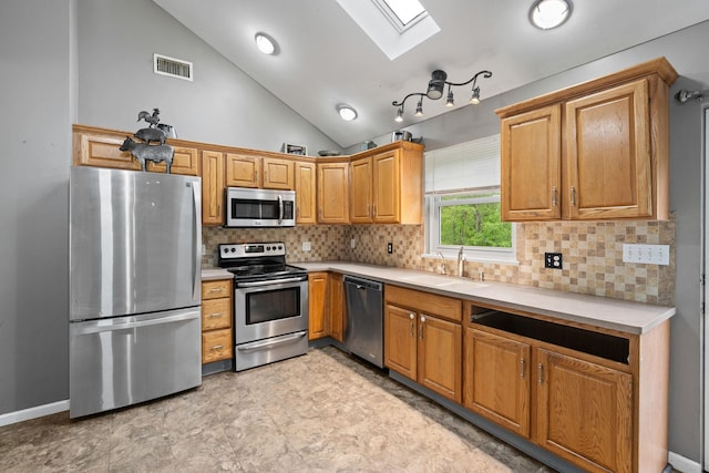 22 Rosio Ln, Modena, NY 12548 - kitchen featuring stainless steel appliances, a skylight, a sink, light countertops, and vaulted ceiling