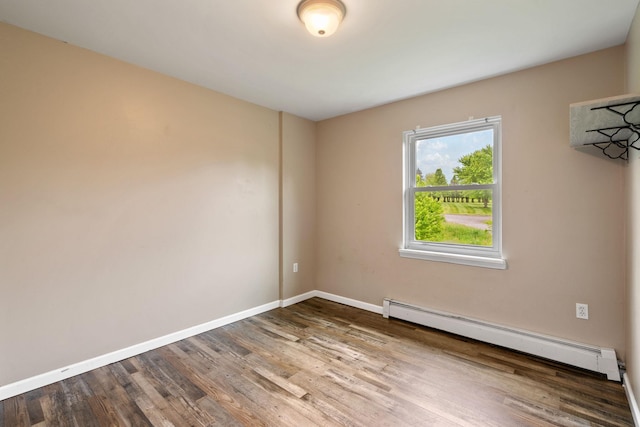 22 Rosio Ln, Modena, NY 12548 - empty room featuring a baseboard radiator, wood finished floors, and baseboards