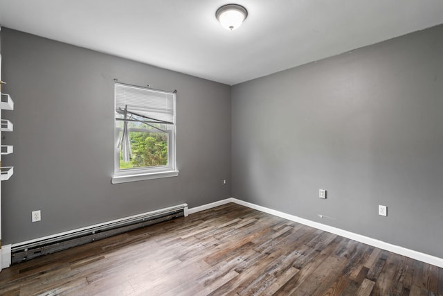 22 Rosio Ln, Modena, NY 12548 - spare room featuring a baseboard heating unit, wood finished floors, and baseboards