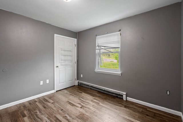 22 Rosio Ln, Modena, NY 12548 - spare room with baseboard heating, wood finished floors, and baseboards