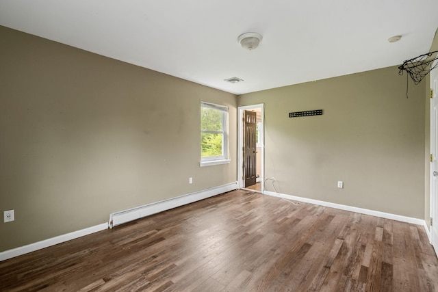 22 Rosio Ln, Modena, NY 12548 - empty room featuring baseboard heating, baseboards, and wood finished floors