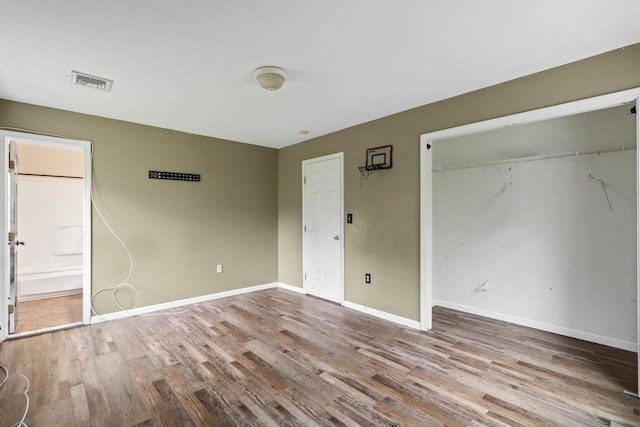 22 Rosio Ln, Modena, NY 12548 - unfurnished bedroom with wood finished floors, a closet, and baseboards