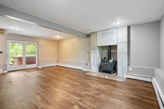 22 Rosio Ln, Modena, NY 12548 - unfurnished living room with a baseboard heating unit, wood finished floors, a wood stove, recessed lighting, and beamed ceiling