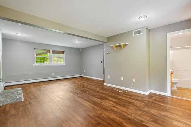 22 Rosio Ln, Modena, NY 12548 - unfurnished living room with a baseboard heating unit, wood finished floors, and baseboards