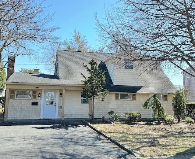 47 Kingfisher Rd, Levittown, NY 11756 - view of front facade featuring roof with shingles