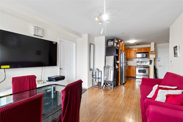 35-38 Junction Blvd Unit 5H, Corona, NY 11368 - living area featuring light wood-type flooring and baseboards