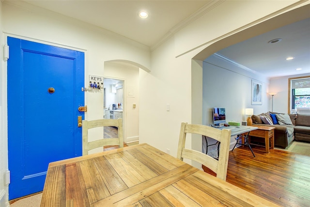 2 Town House Pl Unit 2H, Great Neck, NY 11021 - dining room featuring arched walkways, ornamental molding, recessed lighting, and wood finished floors