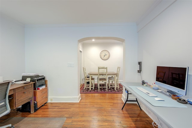 2 Town House Pl Unit 2H, Great Neck, NY 11021 - home office featuring arched walkways, hardwood / wood-style flooring, ornamental molding, and baseboards
