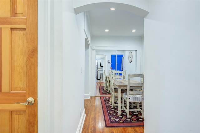 2 Town House Pl Unit 2H, Great Neck, NY 11021 - corridor with wood finished floors, arched walkways, recessed lighting, and baseboards