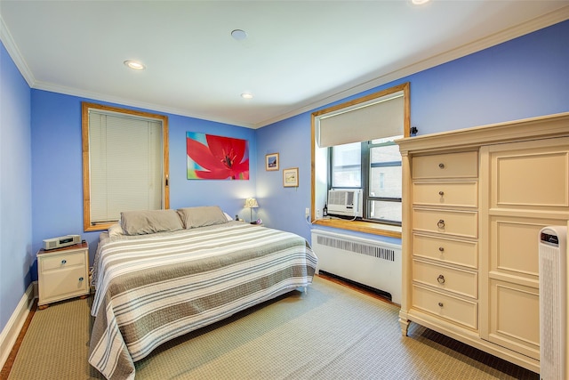 2 Town House Pl Unit 2H, Great Neck, NY 11021 - bedroom featuring radiator heating unit, crown molding, baseboards, recessed lighting, and light colored carpet