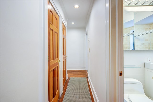 2 Town House Pl Unit 2H, Great Neck, NY 11021 - corridor featuring crown molding, recessed lighting, and baseboards