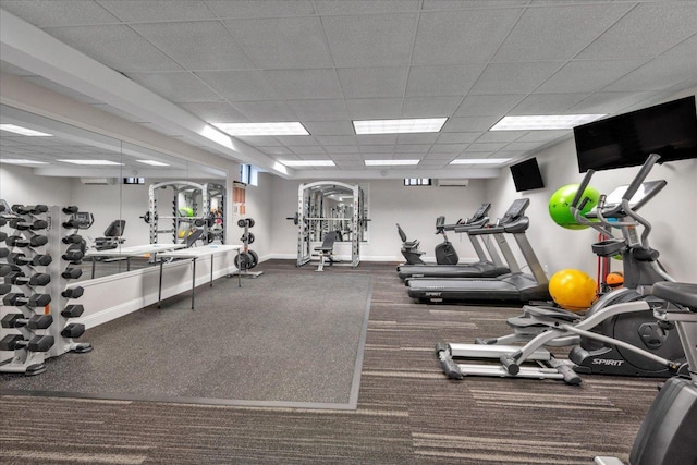 2 Town House Pl Unit 2H, Great Neck, NY 11021 - workout area with baseboards, carpet floors, and a paneled ceiling