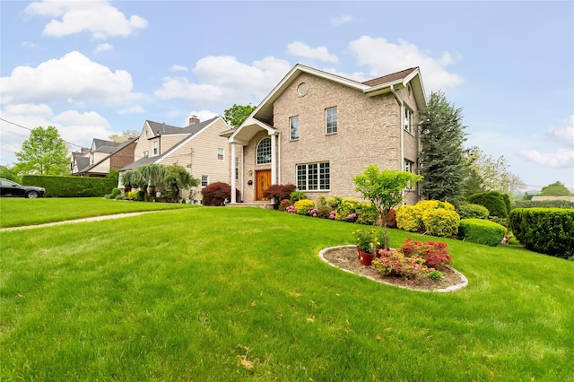 249 Park Ave, Eastchester, NY 10709 - traditional-style home featuring brick siding and a front lawn