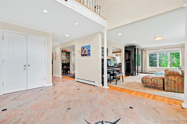 249 Park Ave, Eastchester, NY 10709 - foyer featuring baseboard heating, decorative columns, baseboards, and recessed lighting