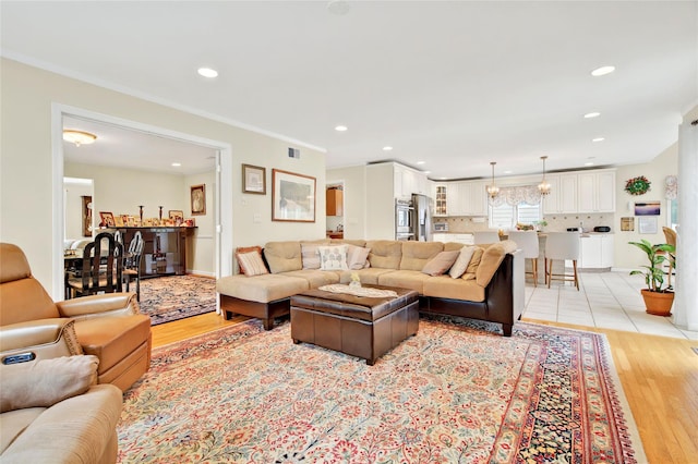 249 Park Ave, Eastchester, NY 10709 - living area with light wood finished floors, recessed lighting, and ornamental molding