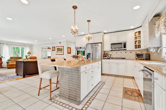 249 Park Ave, Eastchester, NY 10709 - kitchen featuring stainless steel appliances, light tile patterned flooring, a sink, backsplash, and a breakfast bar