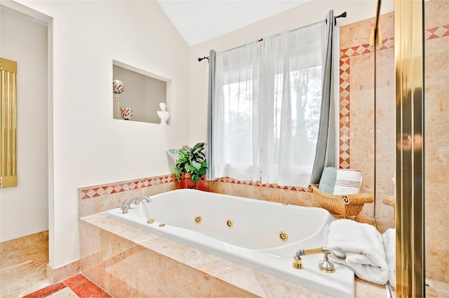 249 Park Ave, Eastchester, NY 10709 - bathroom featuring a jetted tub and lofted ceiling
