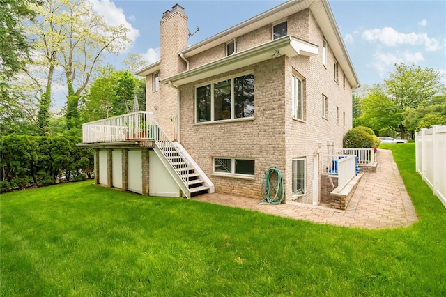 249 Park Ave, Eastchester, NY 10709 - back of property with stairs, a chimney, a deck, a patio, and brick siding