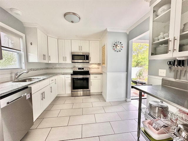 165 Smith Ave, Holbrook, NY 11741 - kitchen featuring stainless steel appliances, a sink, backsplash, white cabinetry, and light tile patterned floors