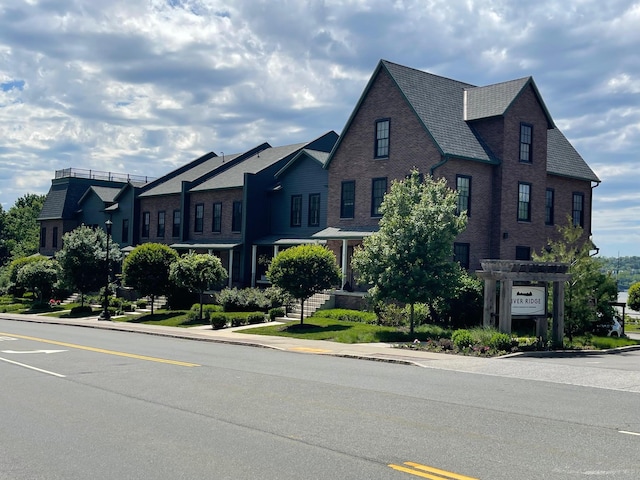 view of front of house with brick siding