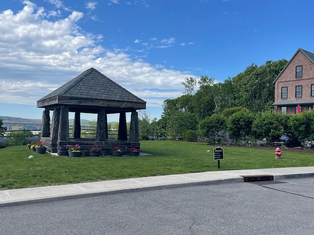 view of property's community featuring a gazebo and a lawn