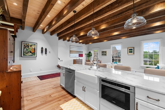 17 River Ridge Court, Beacon, NY 12508 - kitchen featuring open floor plan, a sink, wood ceiling with exposed beams, light wood-type flooring, and white cabinetry
