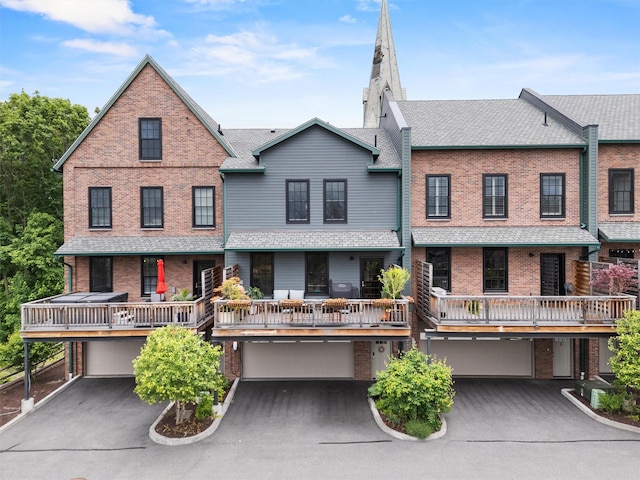 17 River Ridge Court, Beacon, NY 12508 - view of front of home with an attached garage, brick siding, and driveway