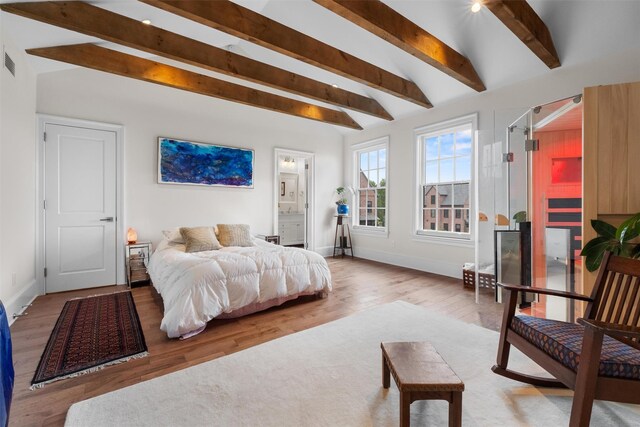 17 River Ridge Court, Beacon, NY 12508 - bedroom featuring beam ceiling, baseboards, wood finished floors, and ensuite bath
