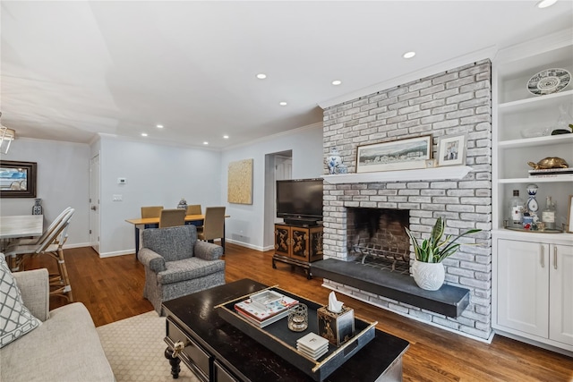216 Purchase St Unit A, Rye, NY 10580 - living area with a fireplace, ornamental molding, recessed lighting, wood finished floors, and baseboards