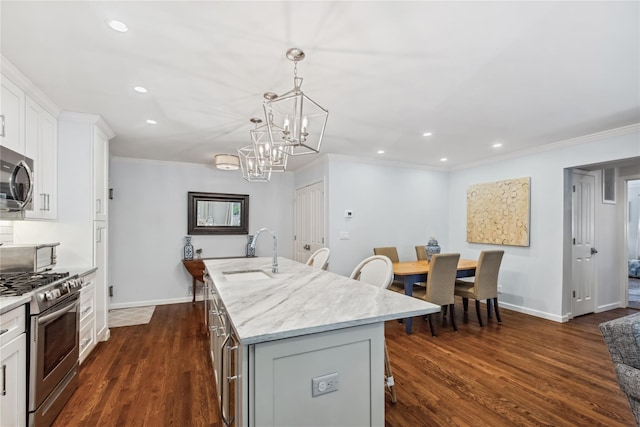 216 Purchase St Unit A, Rye, NY 10580 - kitchen with stainless steel appliances, a sink, a center island with sink, recessed lighting, and a kitchen breakfast bar