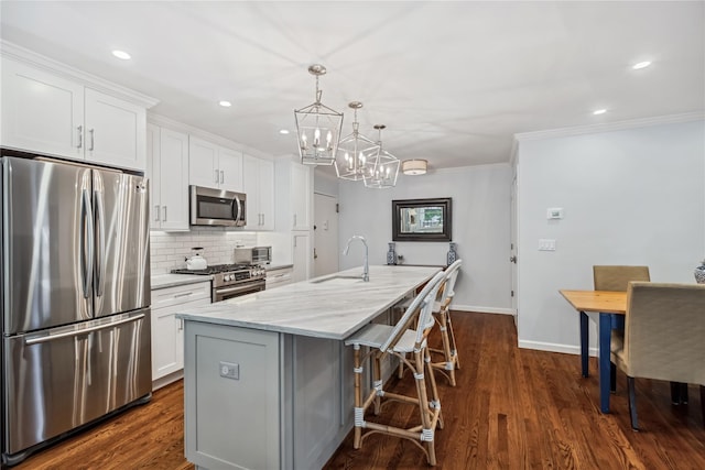 216 Purchase St Unit A, Rye, NY 10580 - kitchen with appliances with stainless steel finishes, a sink, a chandelier, tasteful backsplash, and white cabinets