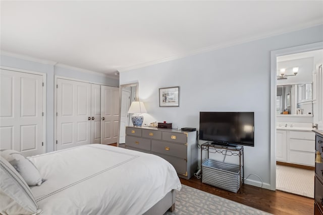 216 Purchase St Unit A, Rye, NY 10580 - bedroom featuring dark wood finished floors, ornamental molding, ensuite bath, and baseboards