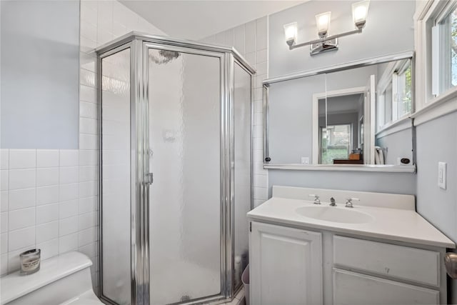 216 Purchase St Unit A, Rye, NY 10580 - full bathroom featuring a shower stall, toilet, vanity, and tile walls