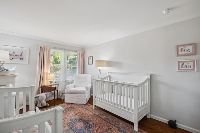 216 Purchase St Unit A, Rye, NY 10580 - bedroom with ornamental molding, wood finished floors, baseboards, and a nursery area