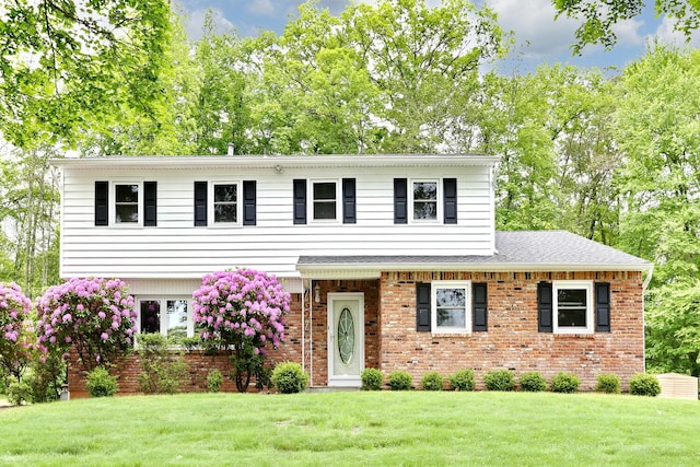 19 Verona Ct, New City, NY 10956 - view of front of home with brick siding and a front yard