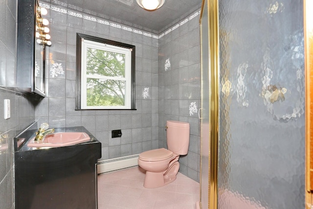 19 Verona Ct, New City, NY 10956 - bathroom with a baseboard radiator, vanity, tile walls, toilet, and tile patterned floors