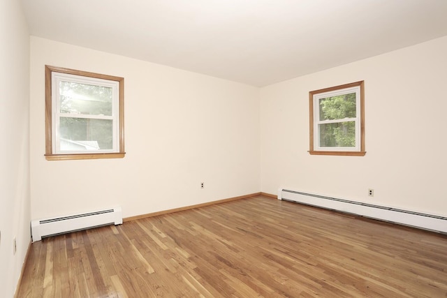 19 Verona Ct, New City, NY 10956 - unfurnished room with baseboard heating, light wood finished floors, and baseboards