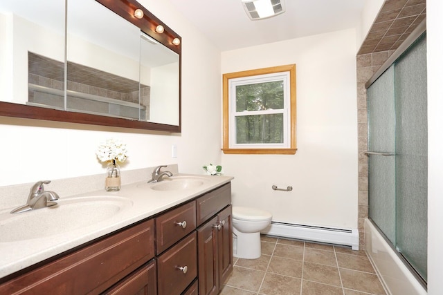 19 Verona Ct, New City, NY 10956 - bathroom with a baseboard radiator, double vanity, toilet, combined bath / shower with glass door, and tile patterned flooring