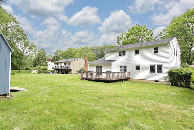 19 Verona Ct, New City, NY 10956 - rear view of house featuring a wooden deck, a lawn, and a shingled roof