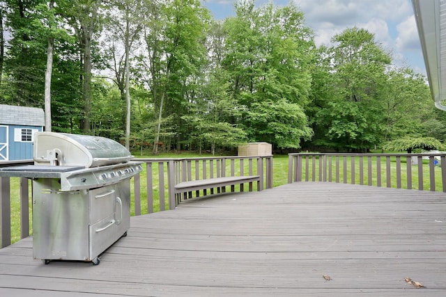 19 Verona Ct, New City, NY 10956 - wooden terrace with a grill, a lawn, and view of wooded area