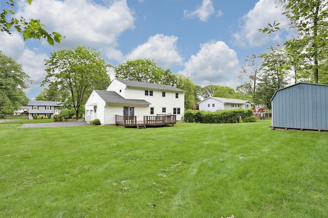 19 Verona Ct, New City, NY 10956 - back of house featuring a wooden deck, a yard, and a shingled roof