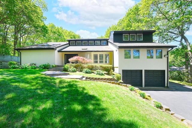 12 Deanna Ct, Dix Hills, NY 11746 - mid-century modern home with an attached garage, asphalt driveway, and a front yard