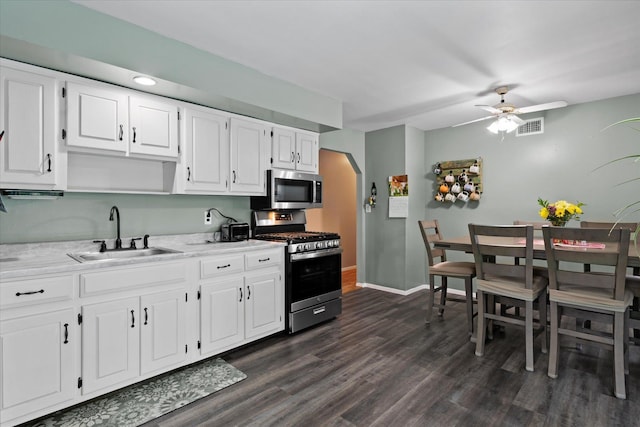 12 Debragga Ave, East Moriches, NY 11940 - kitchen with stainless steel appliances, a sink, dark wood-style floors, ceiling fan, and white cabinets