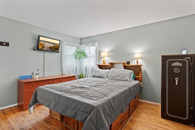 12 Debragga Ave, East Moriches, NY 11940 - bedroom with light wood-style flooring and baseboards